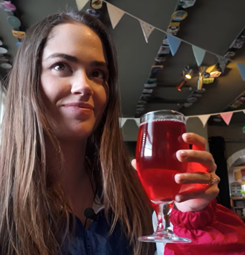 Rose Ruland at the Blackfriars Tavern in Great Yarmouth drinking a glass of Black Cherry Cider